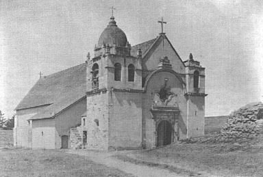 Historic photo of Carmel Mission with peaked roof.
